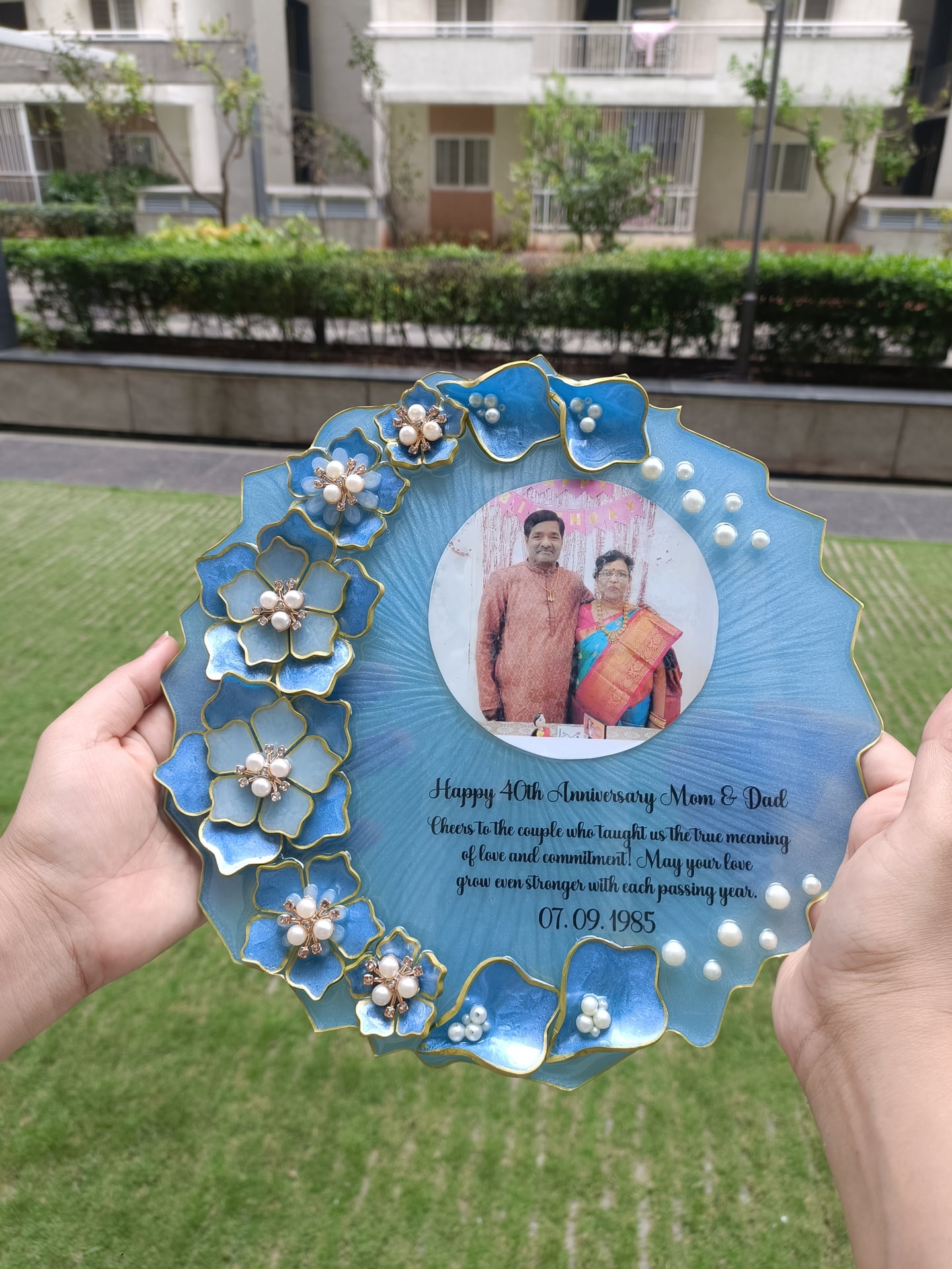 Blue floral resin plaque with a photograph and 40th anniversary message