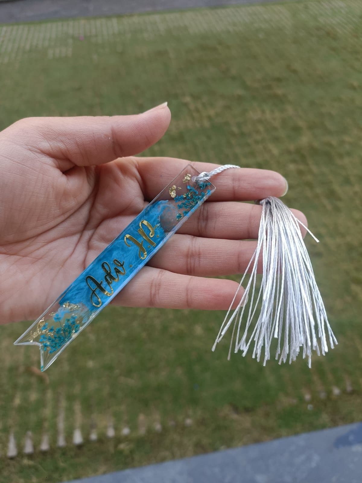Blue resin bookmark with a white tassel