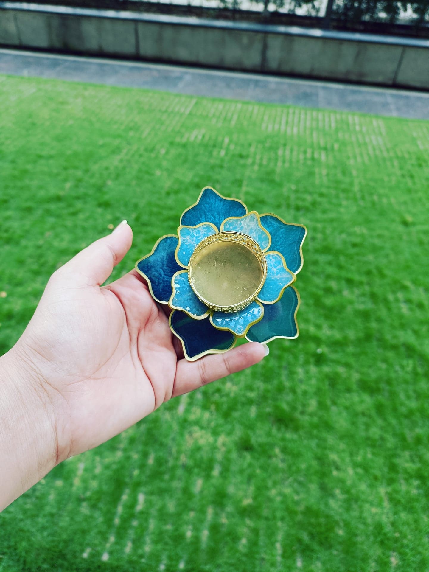 Teal and gold lotus-shaped resin diya holder