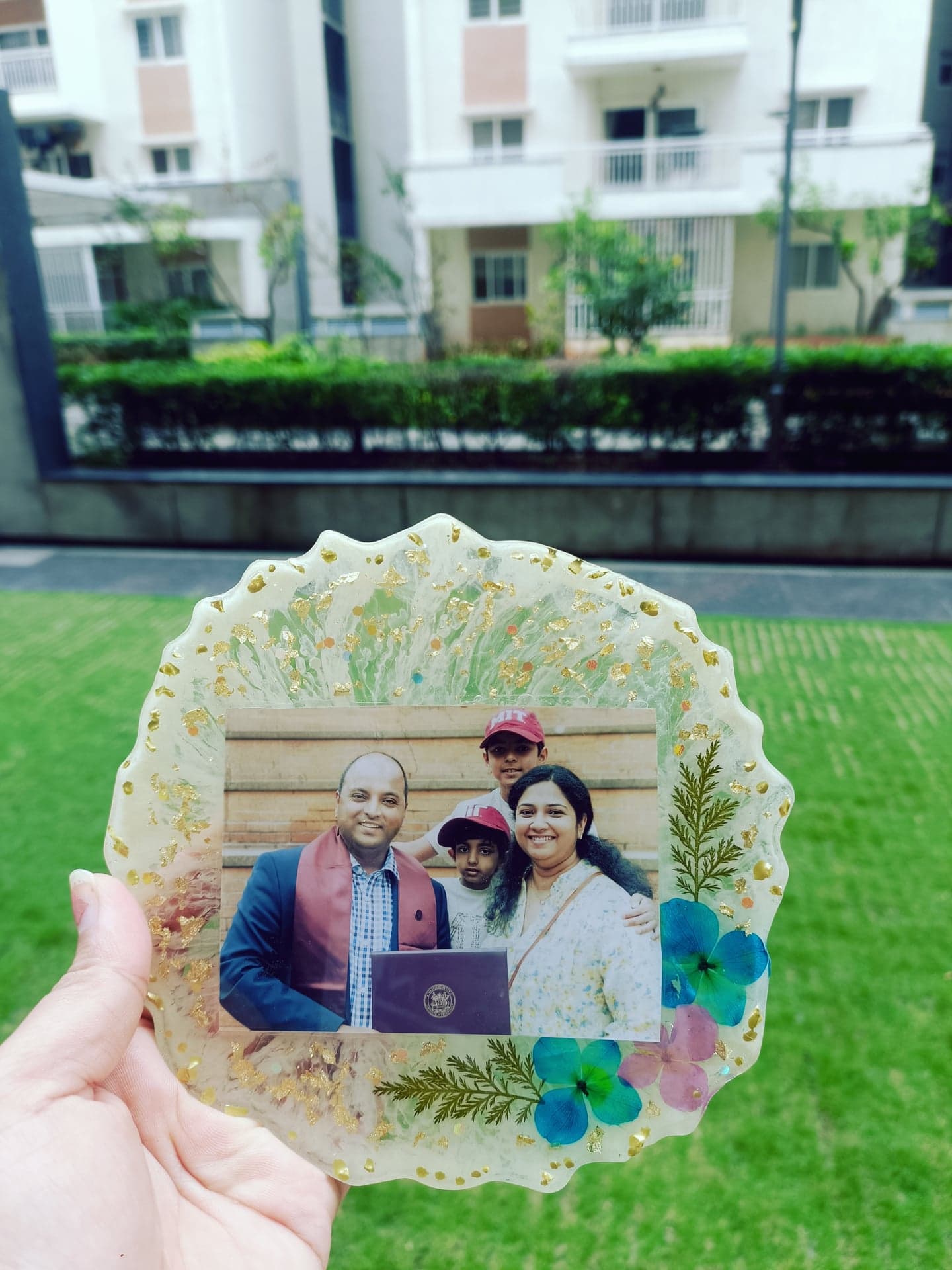 Resin photo frame with pressed flowers and a family photograph